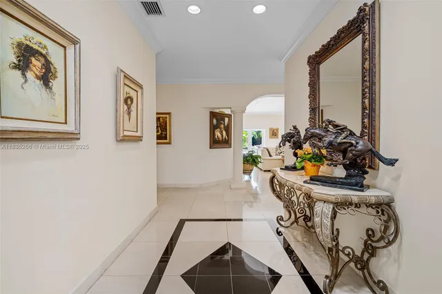 a view of an empty room with painting on the wall