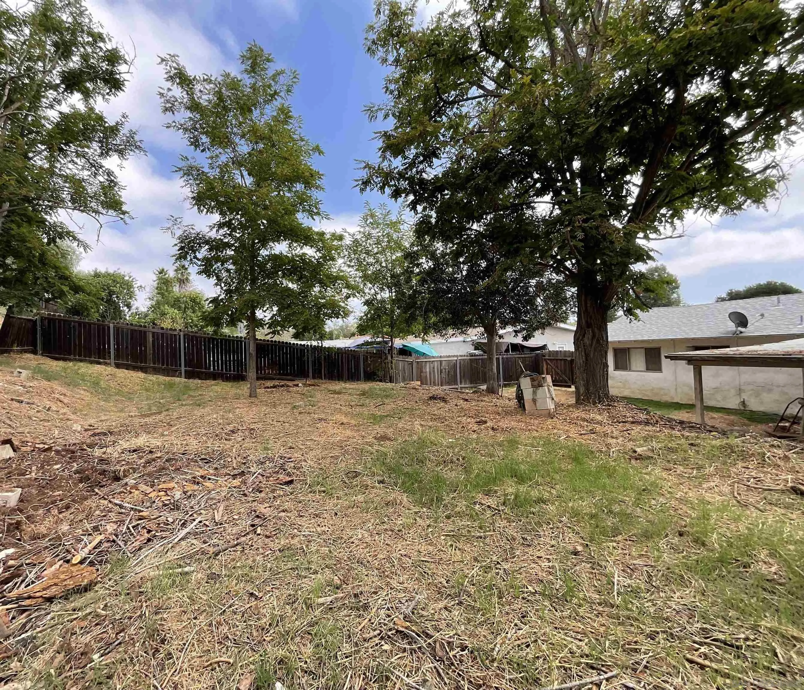 1221 Rees Road Escondido, CA 92026 - Photo 18 of 20 a backyard of a house with lots of green space