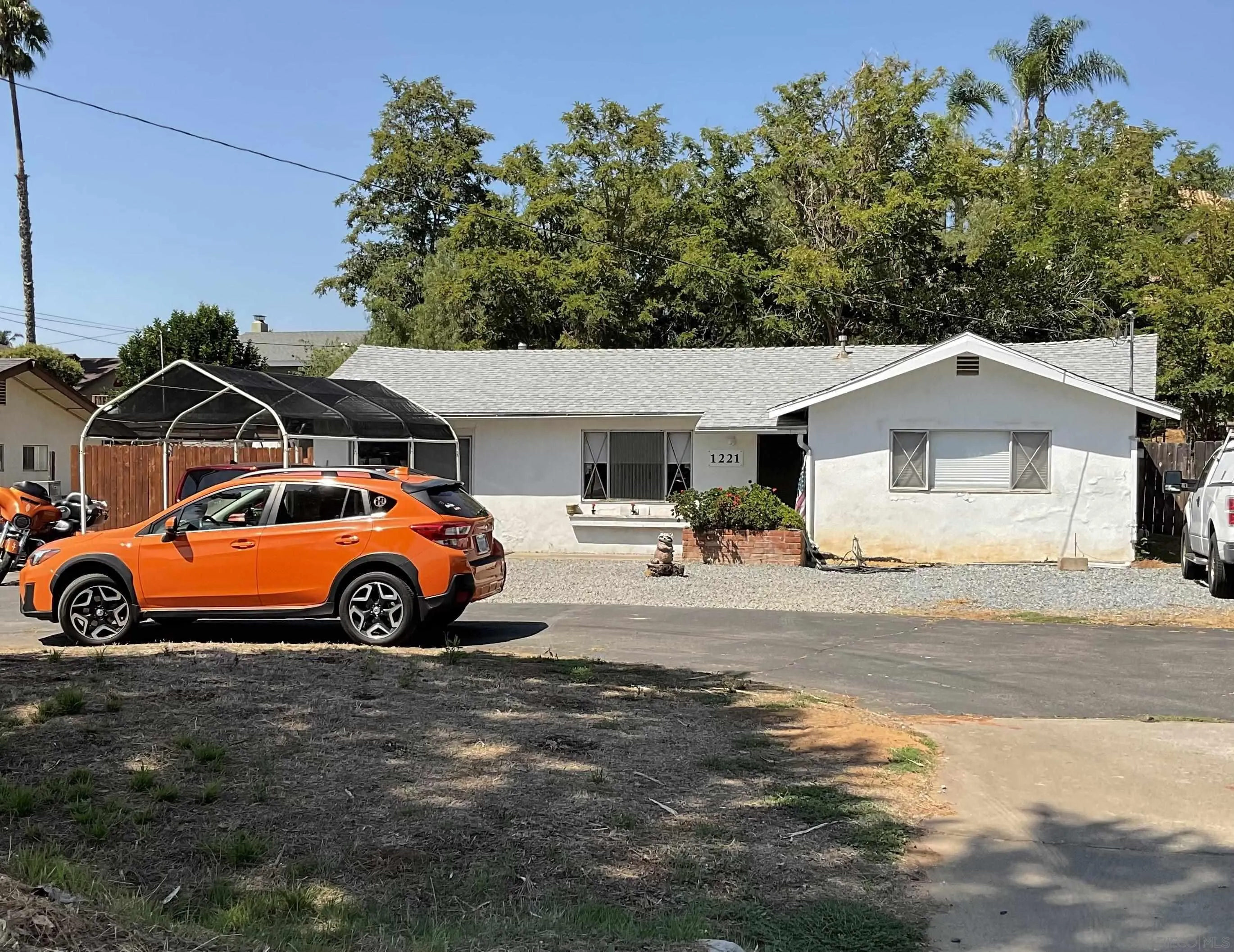 1221 Rees Road Escondido, CA 92026 - Photo 2 of 20 a view of a car parked in front of a house