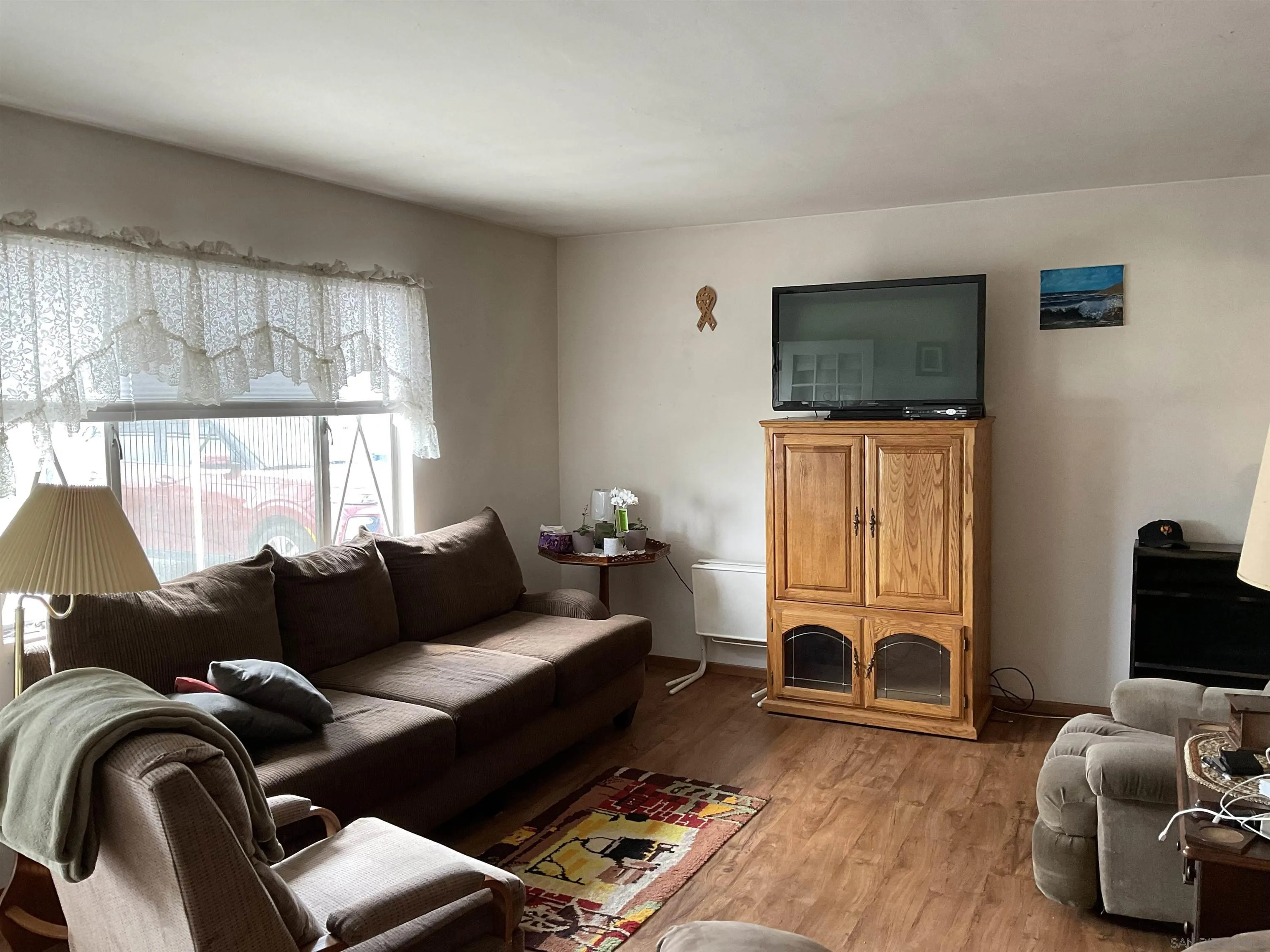 1221 Rees Road Escondido, CA 92026 - Photo 3 of 20 a living room with furniture and a flat screen tv