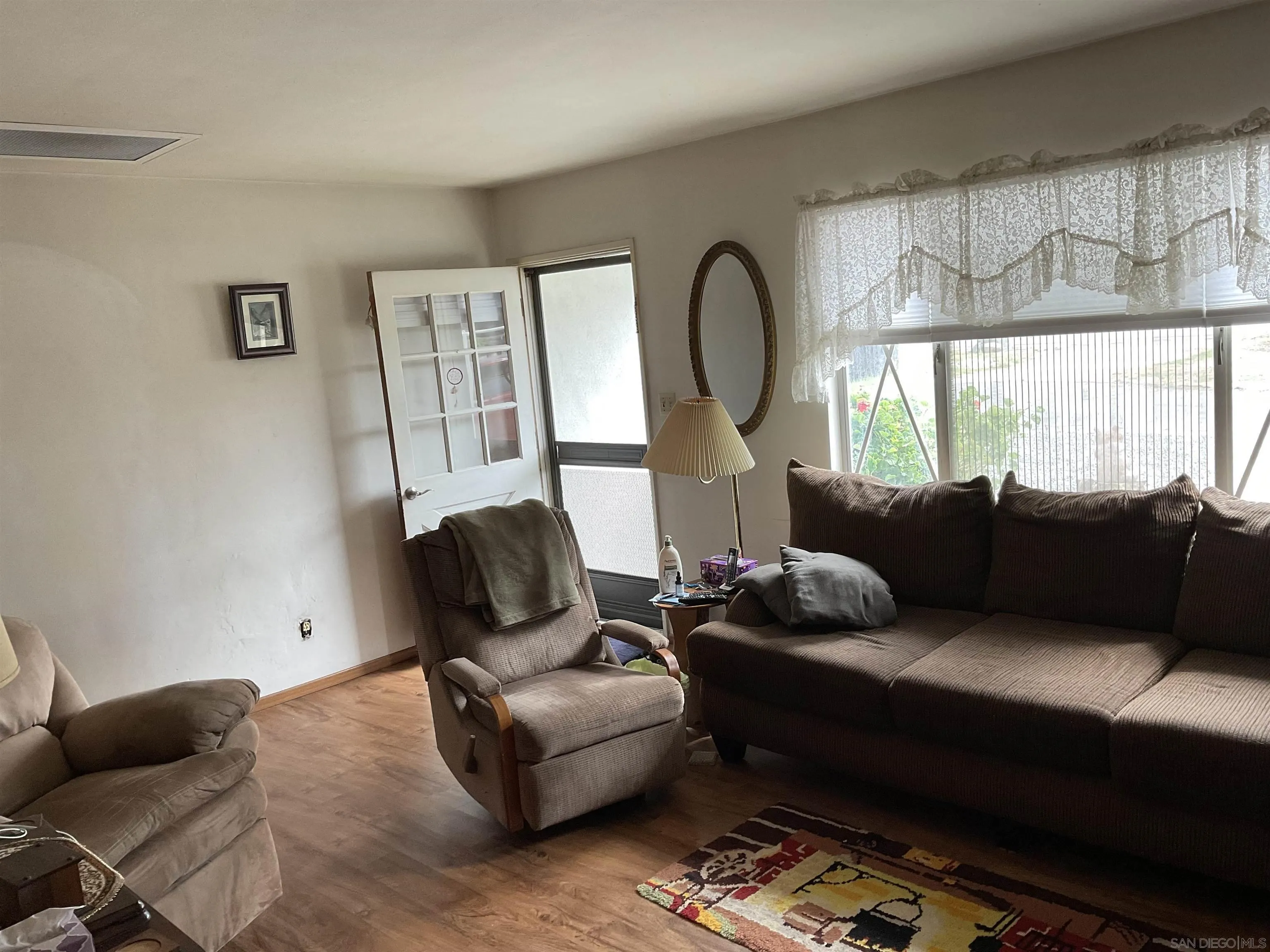 1221 Rees Road Escondido, CA 92026 - Photo 4 of 20 a living room with furniture and a window