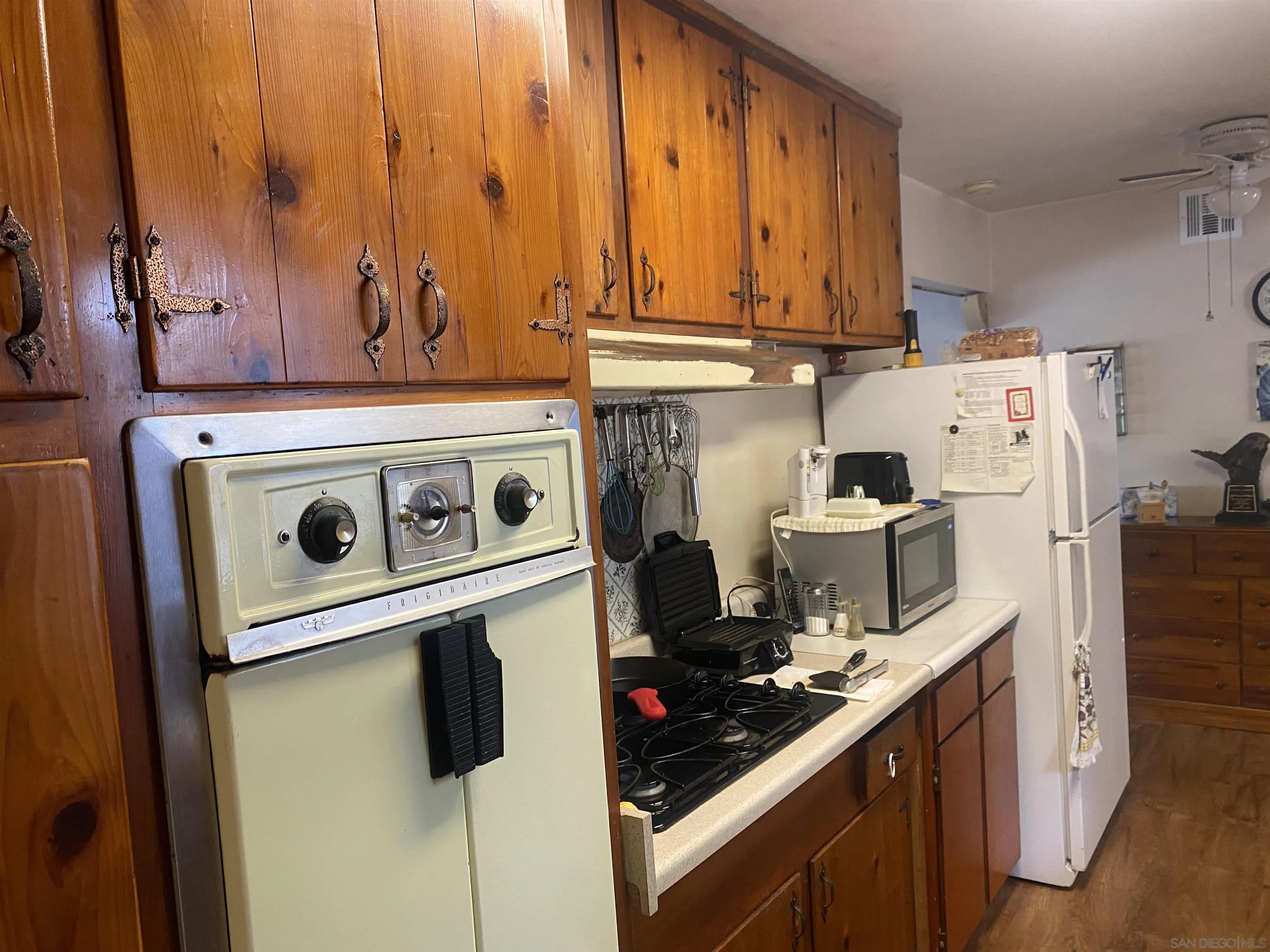 1221 Rees Road Escondido, CA 92026 - Photo 7 of 20 a kitchen with a stove and a refrigerator
