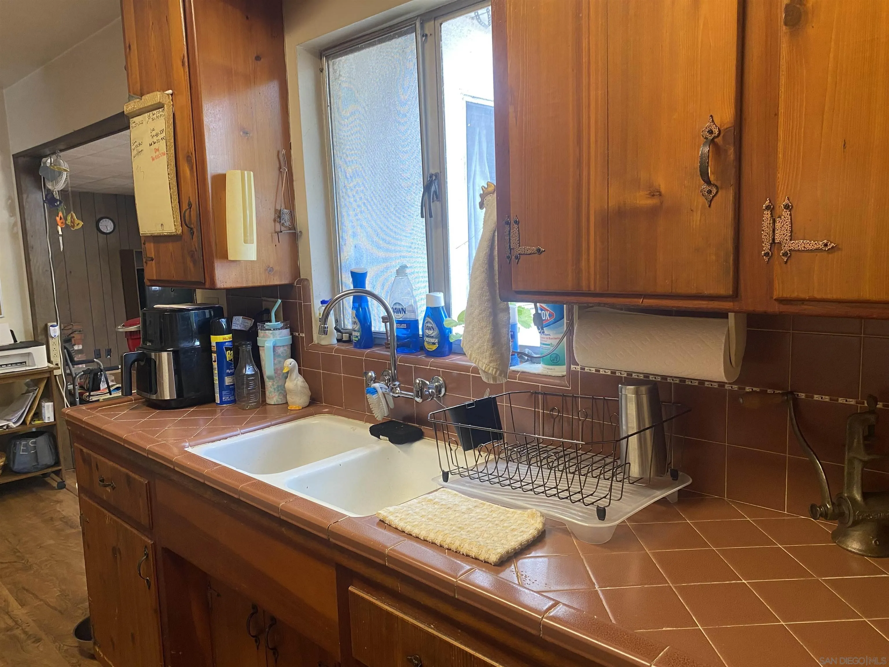 1221 Rees Road Escondido, CA 92026 - Photo 8 of 20 a kitchen with a sink and a cabinets