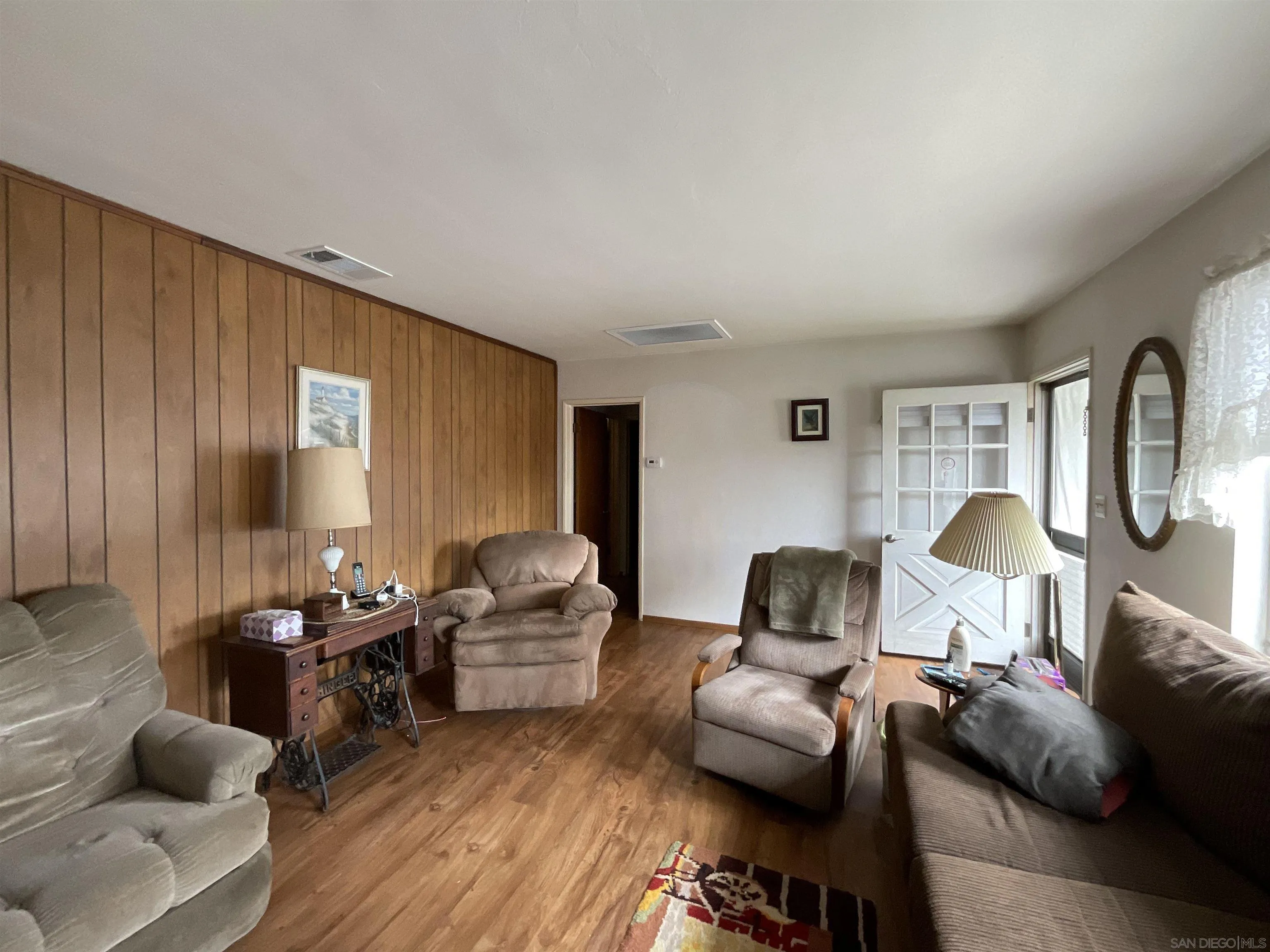 1221 Rees Road Escondido, CA 92026 - Photo 9 of 20 a living room with furniture and a window