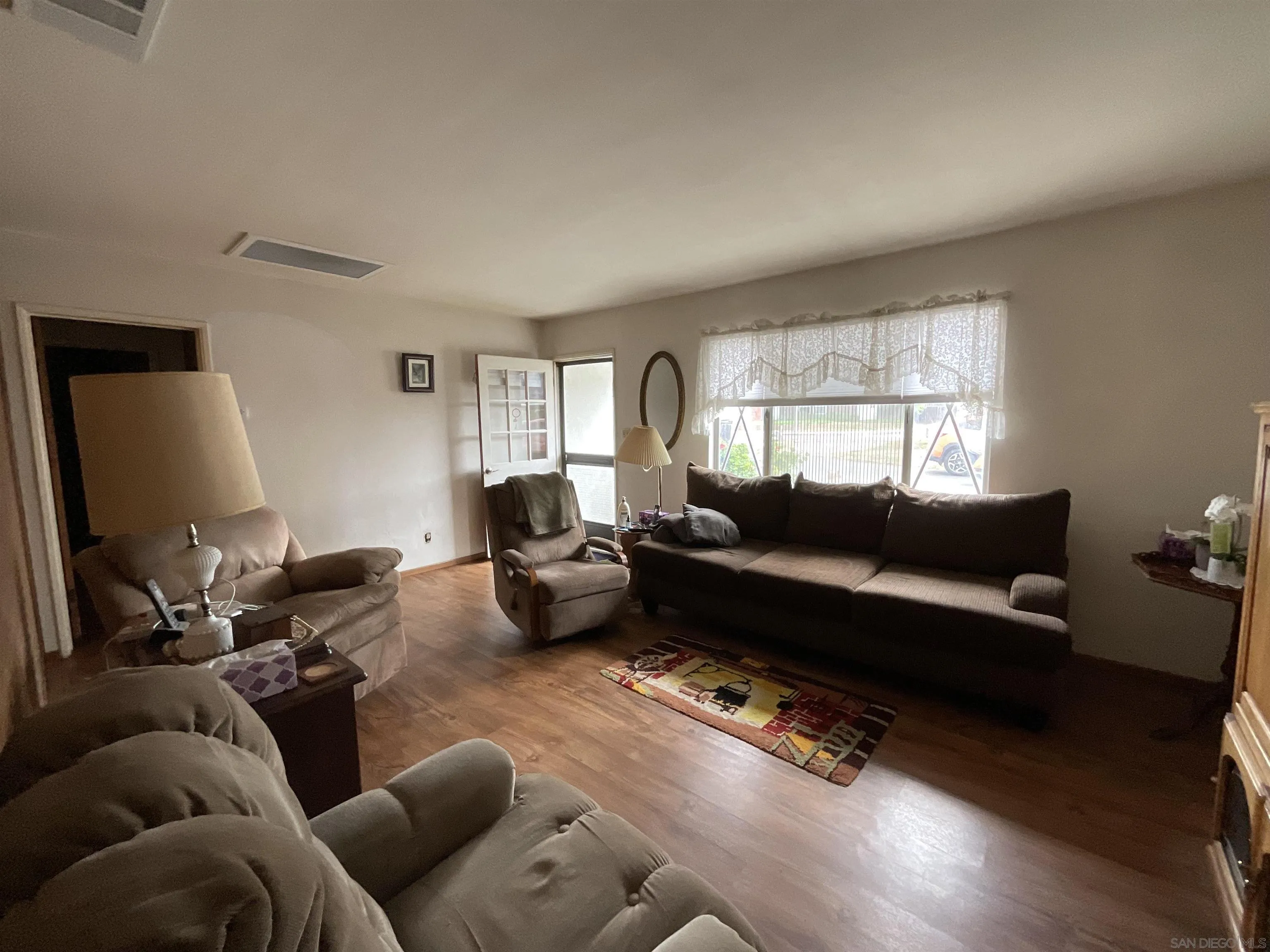 1221 Rees Road Escondido, CA 92026 - Photo 10 of 20 a living room with furniture and a flat screen tv