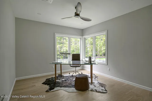 a dining room with table and chairs