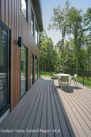 a view of balcony with wooden floor and outdoor space