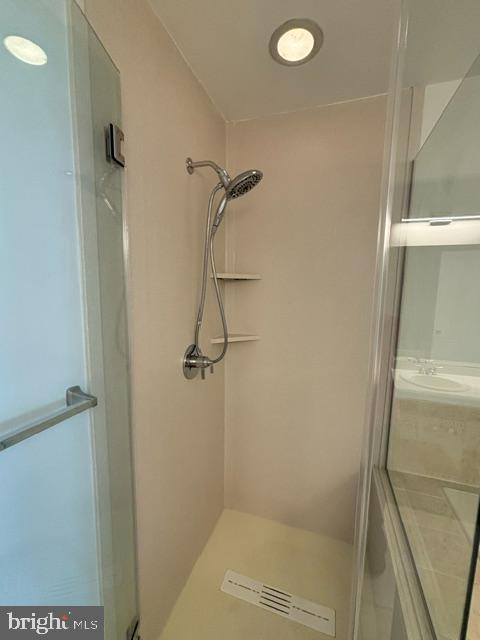 57 Windsor Pond Road Princeton Junction, NJ 08550 - Photo 19 of 37 a bathroom with a glass shower door