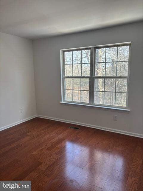 57 Windsor Pond Road Princeton Junction, NJ 08550 - Photo 27 of 37 an empty room with wooden floor and windows