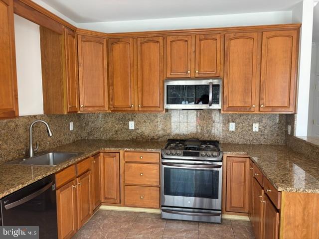 57 Windsor Pond Road Princeton Junction, NJ 08550 - Photo 29 of 37 a kitchen with granite countertop a sink and steel appliances