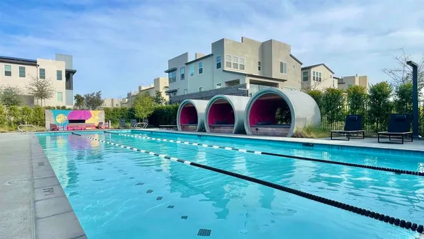 a view of swimming pool from a balcony