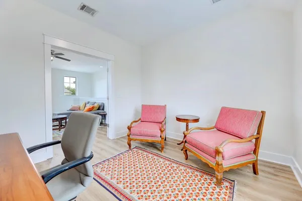 a room with furniture and a rug