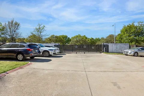 a view of a car parked in front of a house