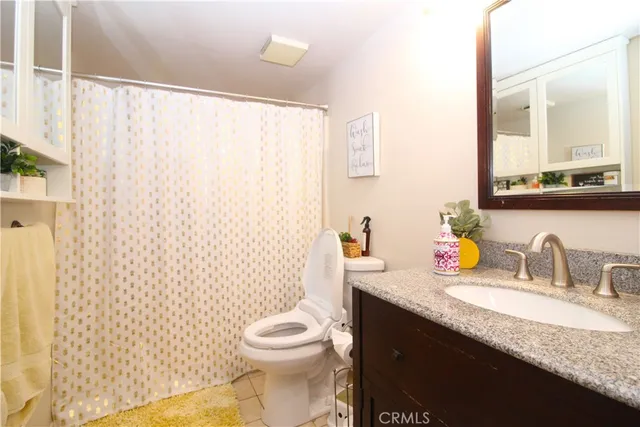 a bedroom with a bed and couch