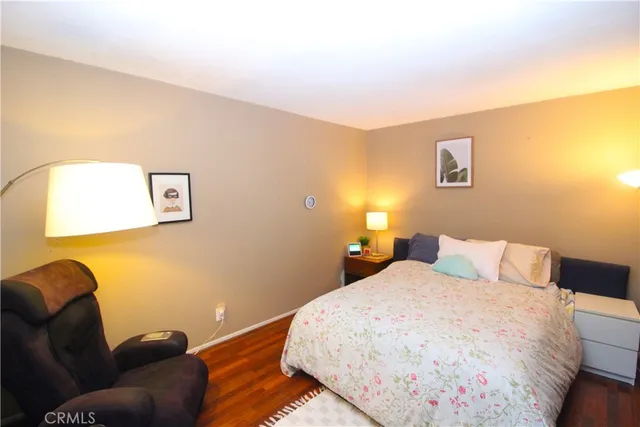 a bedroom with a bed and a window with outer view