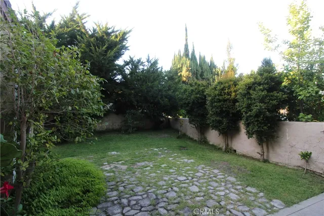 a living room with furniture a dining table and a window