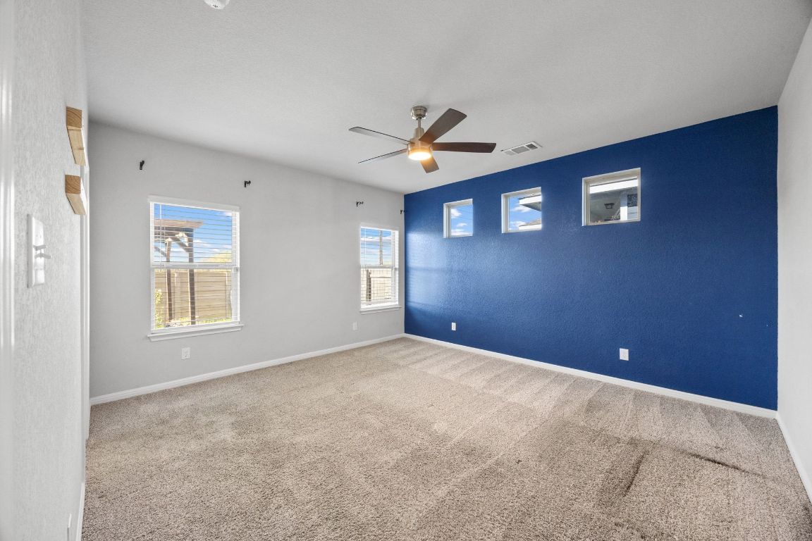 225 Unforgiven Lane Jarrell, TX 76537 - Photo 10 of 27 a view of an empty room with a window