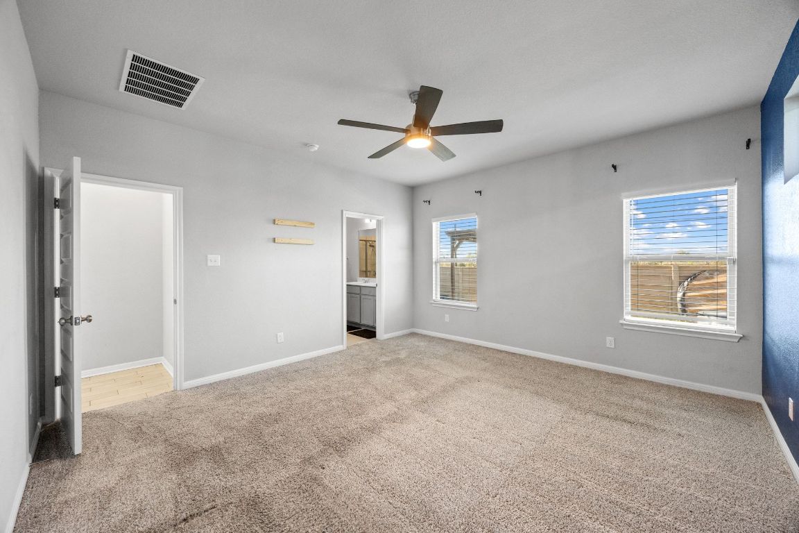 225 Unforgiven Lane Jarrell, TX 76537 - Photo 11 of 27 a view of an empty room with a window