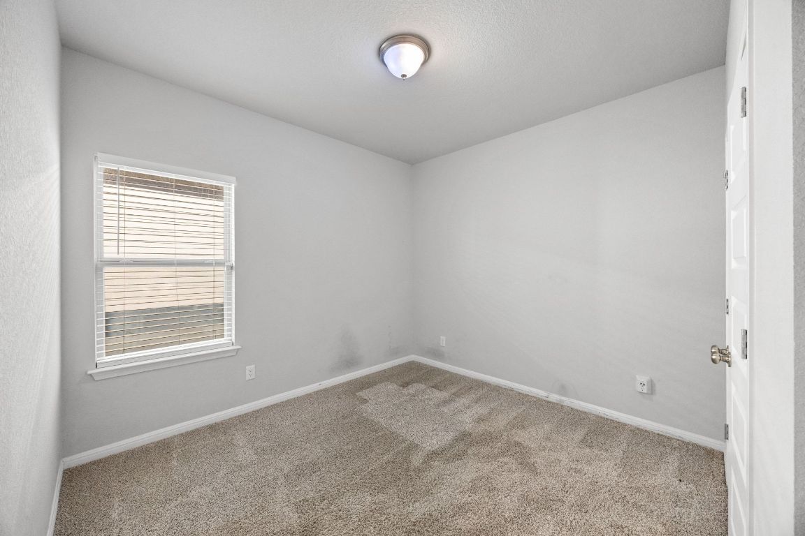 225 Unforgiven Lane Jarrell, TX 76537 - Photo 15 of 27 an empty room with a window