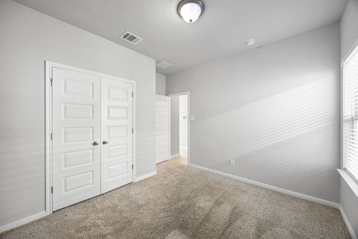 225 Unforgiven Lane Jarrell, TX 76537 - Photo 16 of 27 an empty room with closet area