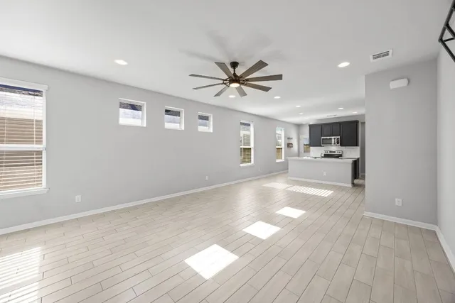 a view of a kitchen with a sink and a window