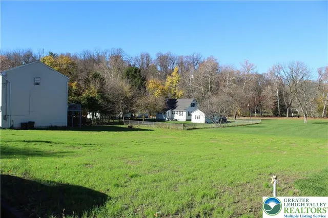 a view of a tiny house with a yard