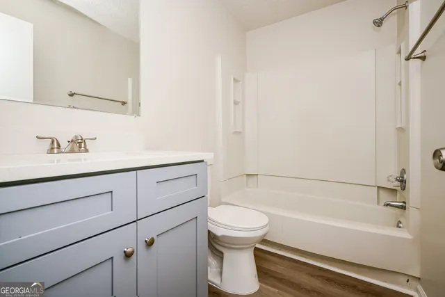 a bathroom with a sink toilet and bathtub