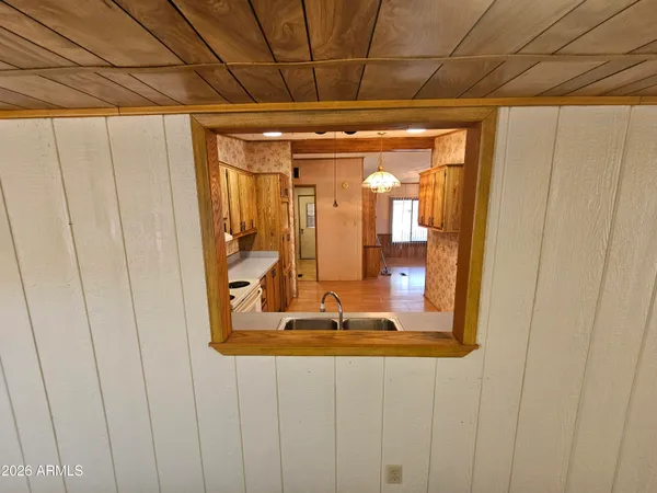 a view of walk in closet with clothes