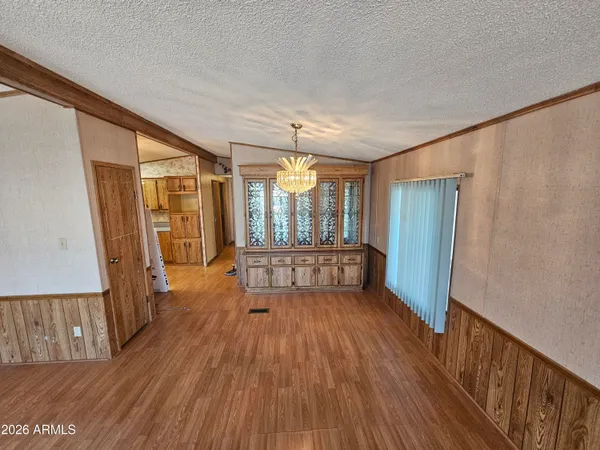 a view of a room with wooden floor window and fireplace