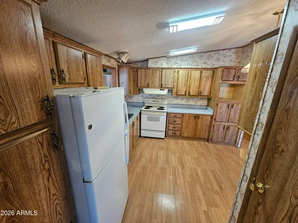 a view of kitchen with wooden floor
