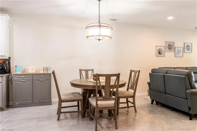 a dining room with furniture and window