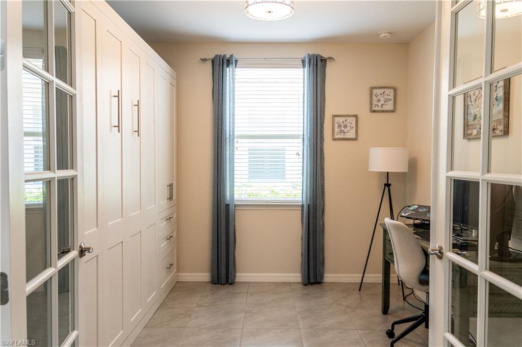 14888 Edgewater Circle Naples, FL 34114 - Photo 18 of 33 a view of an entryway with wooden floor