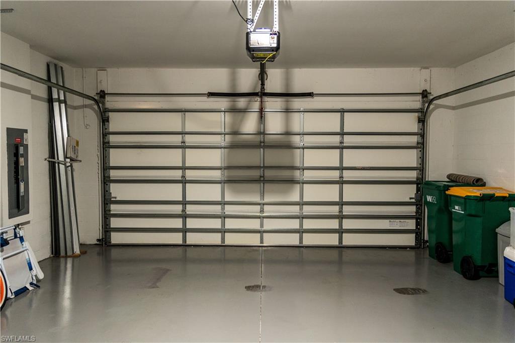 14888 Edgewater Circle Naples, FL 34114 - Photo 23 of 33 a view of a room with a staircase and a ceiling fan