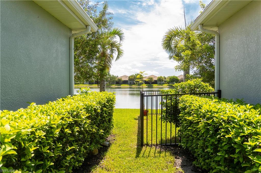 14888 Edgewater Circle Naples, FL 34114 - Photo 24 of 33 a view of a garden with lake