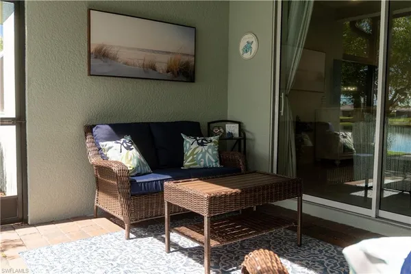 a outdoor living space with furniture and a rug