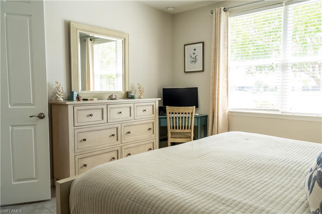14888 Edgewater Circle Naples, FL 34114 - Photo 5 of 33 a bedroom with a bed and a window