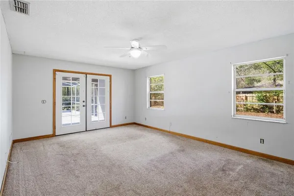 a view of empty room with windows
