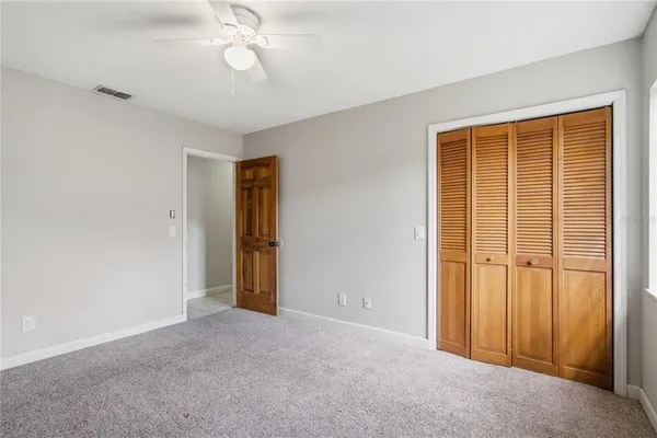 a view of empty room with windows