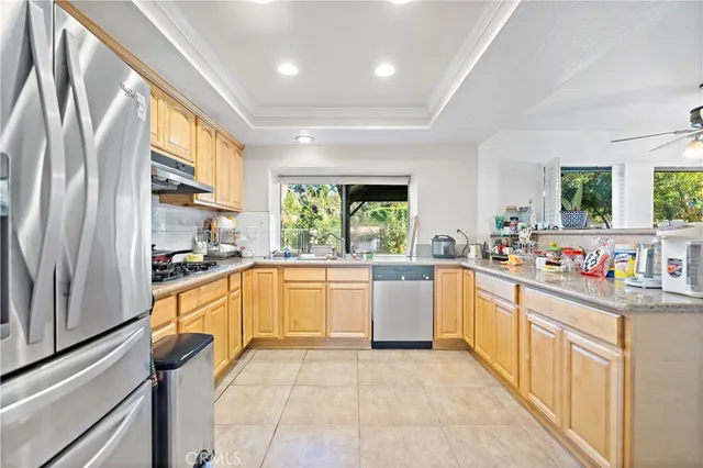 a kitchen with stainless steel appliances a stove sink and cabinets