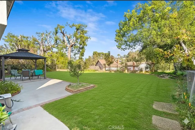 a view of a swimming pool with a yard