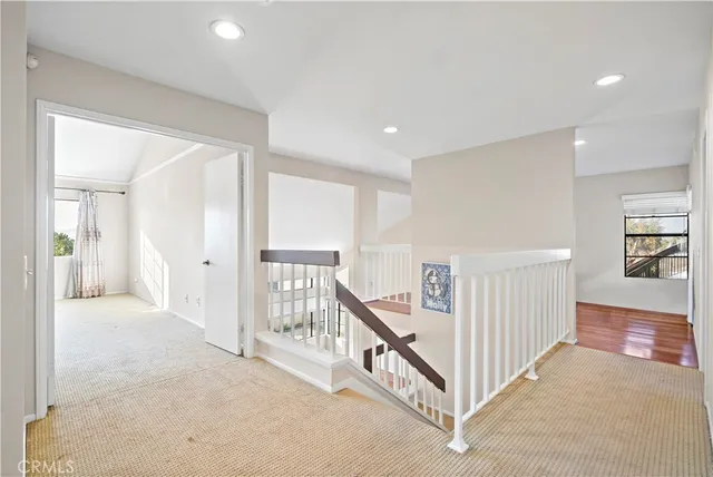 a view of a hallway with windows