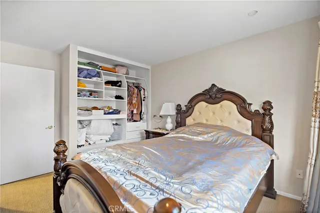 a bedroom with a bed and closet