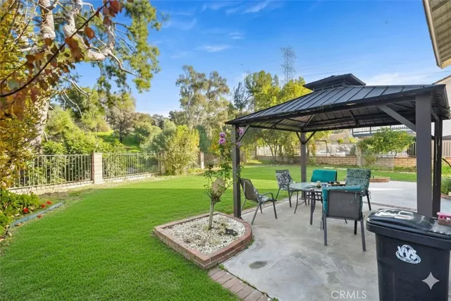 a view of a patio with chairs and a table