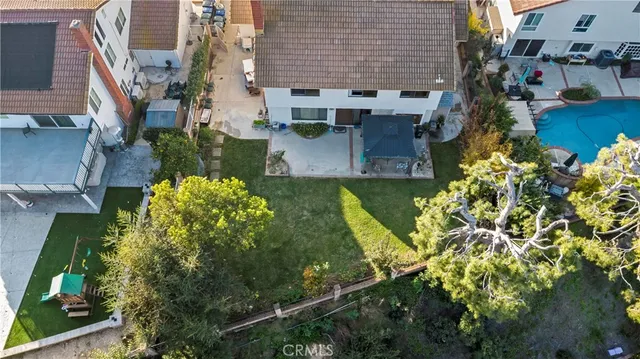 an aerial view of a house with a garden