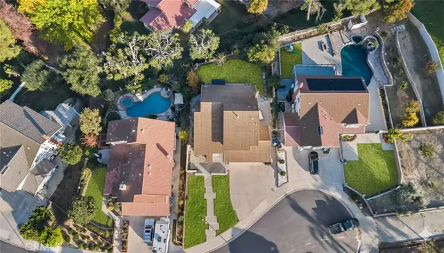 an aerial view of houses with outdoor space