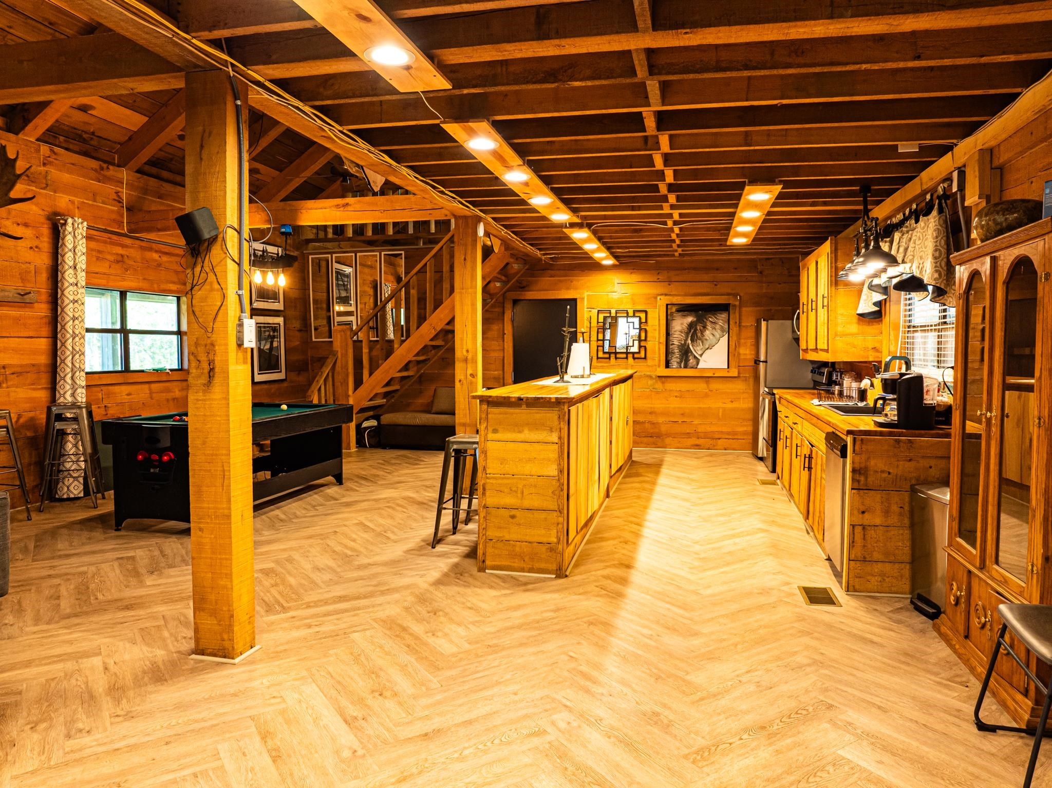 280 Fields Road Dukedom, TN 38226 - Photo 27 of 40 Kitchen featuring wooden walls, wooden counters, a breakfast bar area, parquet floors, and pool table