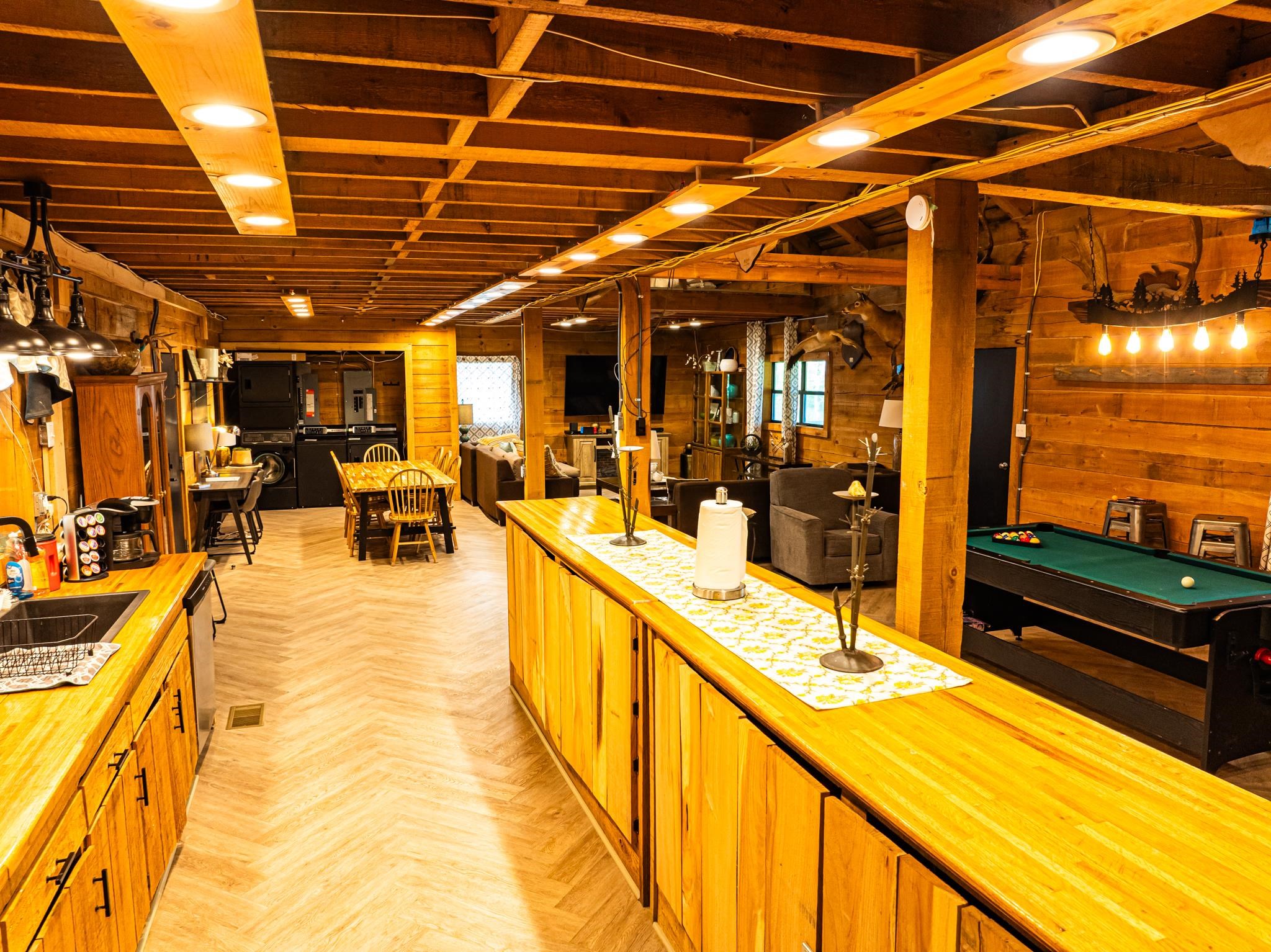 280 Fields Road Dukedom, TN 38226 - Photo 30 of 40 Kitchen featuring wood walls, parquet floors, billiards, washer / clothes dryer, and wooden counters