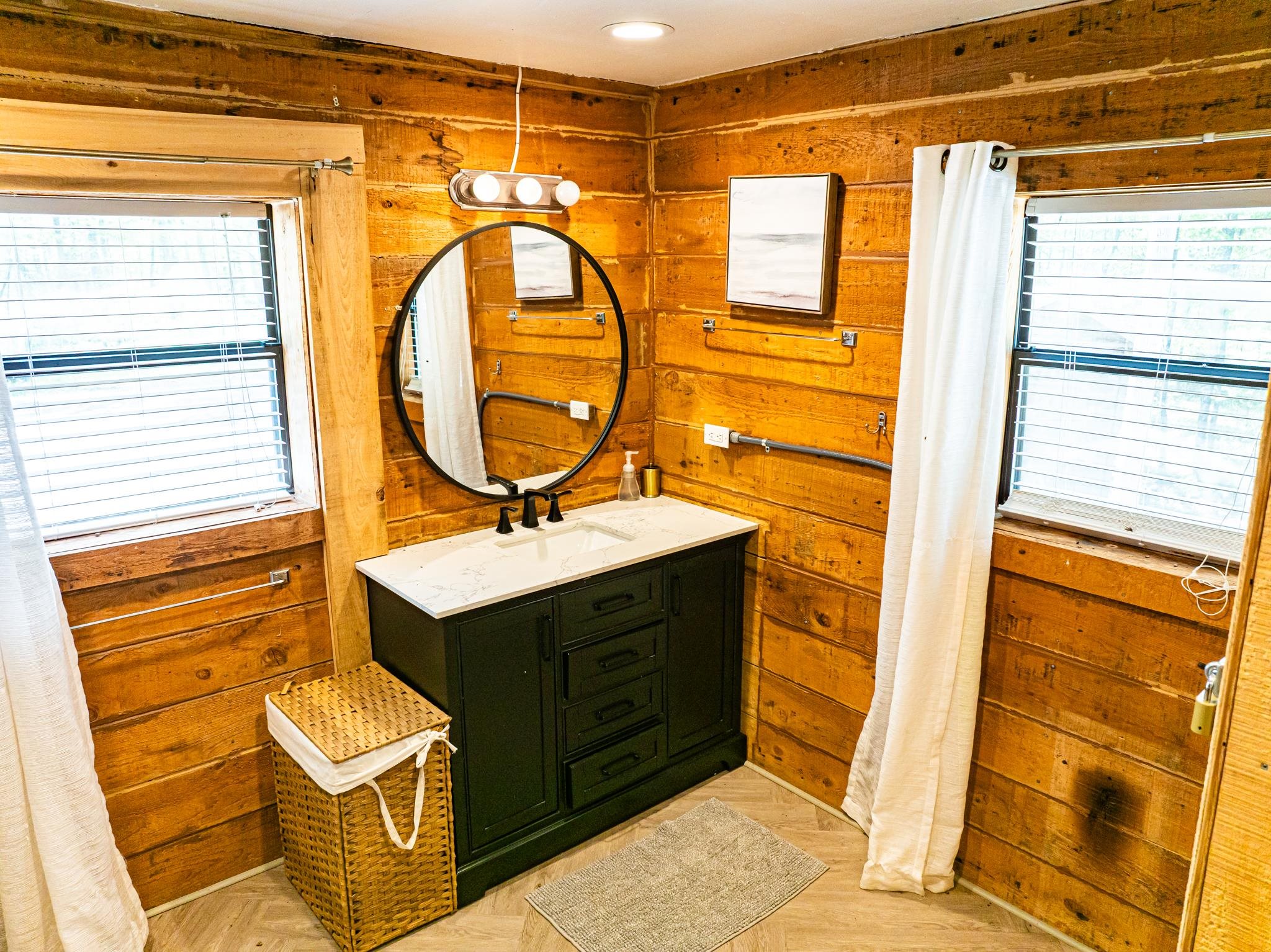 280 Fields Road Dukedom, TN 38226 - Photo 33 of 40 Bathroom featuring vanity, wood walls, parquet flooring, and recessed lighting