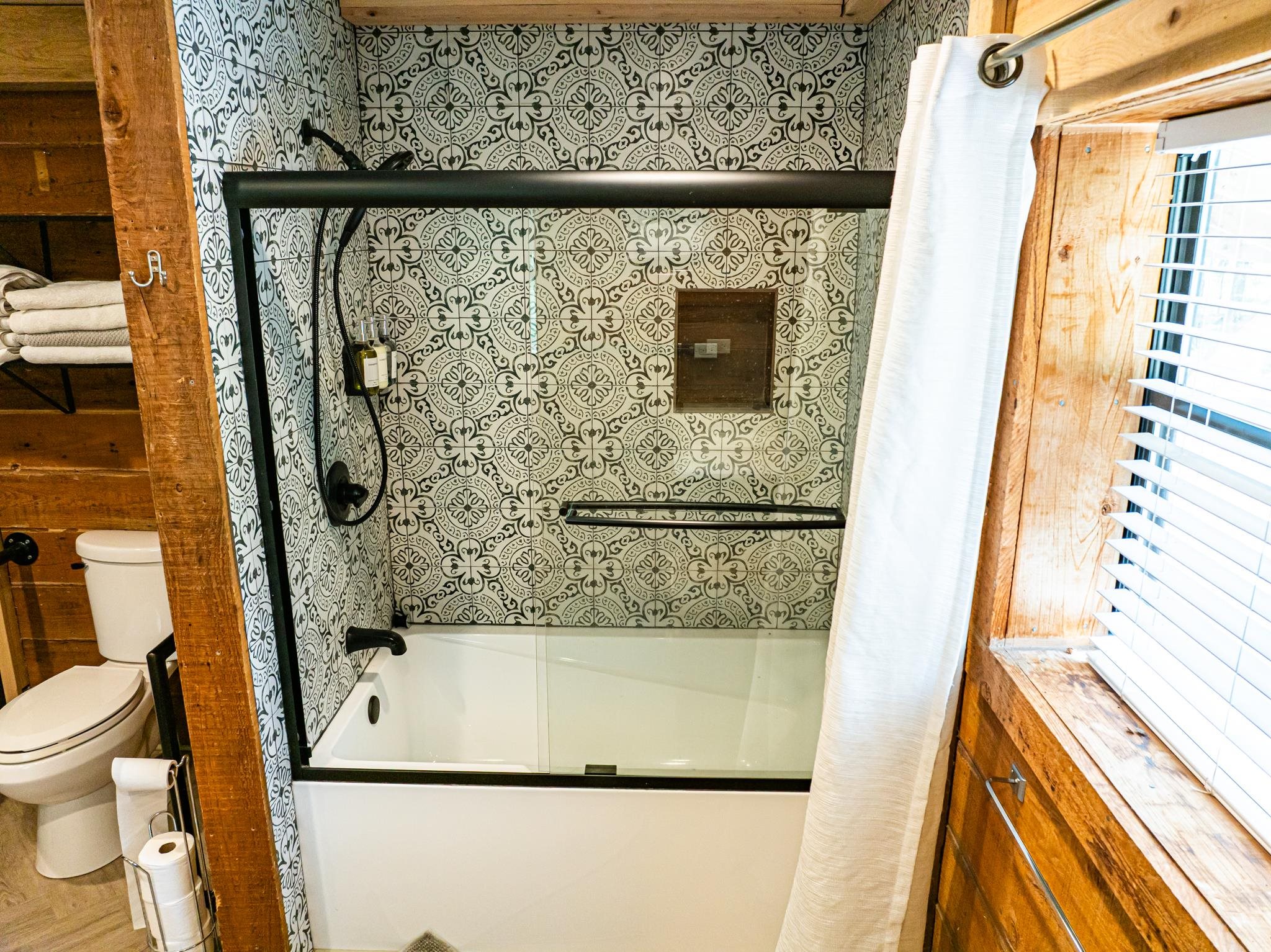 280 Fields Road Dukedom, TN 38226 - Photo 34 of 40 Full bath with enclosed tub / shower combo and toilet