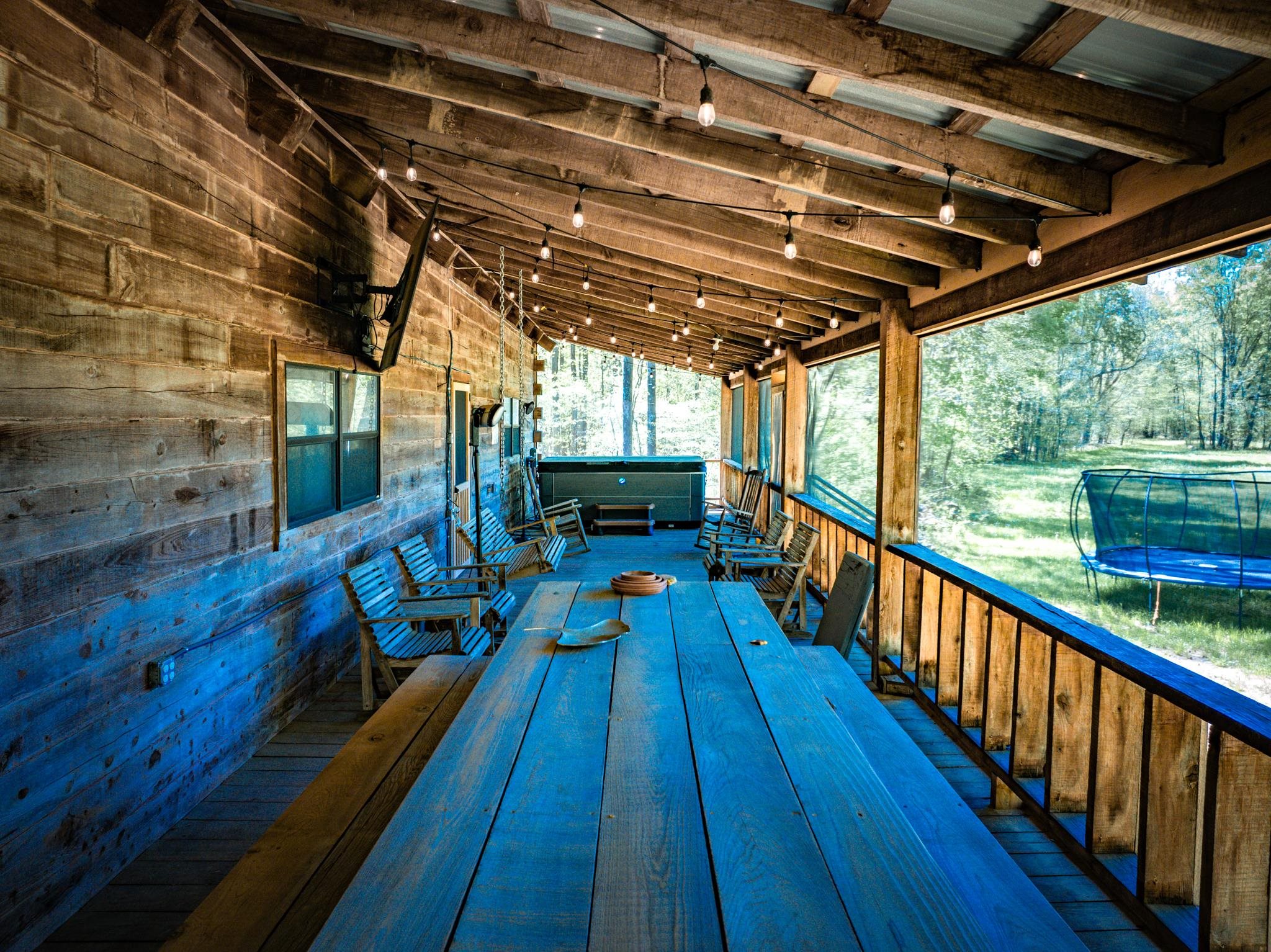 280 Fields Road Dukedom, TN 38226 - Photo 35 of 40 Deck featuring a trampoline and a hot tub